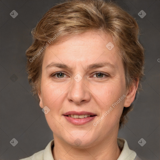 Joyful white adult female with short  brown hair and grey eyes