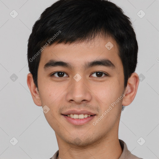 Joyful white young-adult male with short  black hair and brown eyes