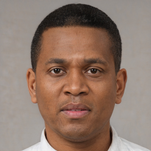 Neutral black adult male with short  brown hair and brown eyes