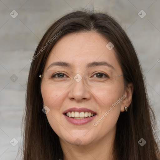 Joyful white adult female with long  brown hair and brown eyes