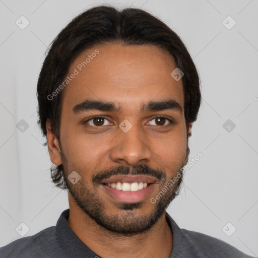 Joyful latino young-adult male with short  black hair and brown eyes