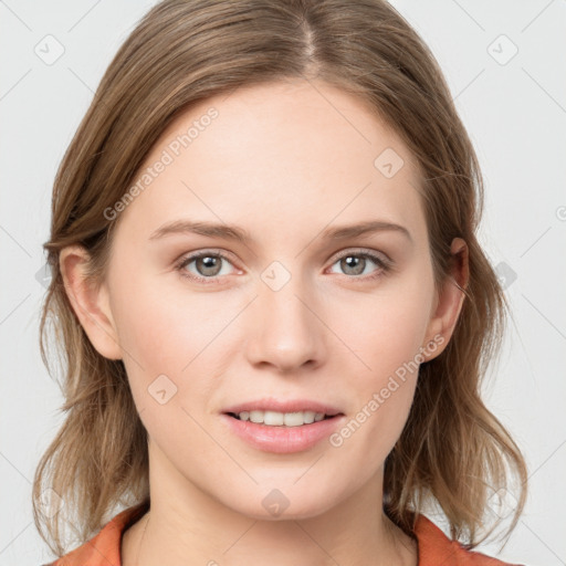 Joyful white young-adult female with medium  brown hair and blue eyes