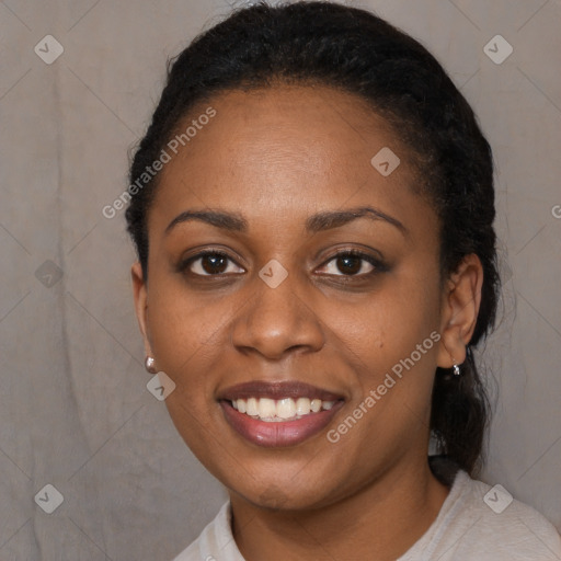 Joyful black young-adult female with short  black hair and brown eyes