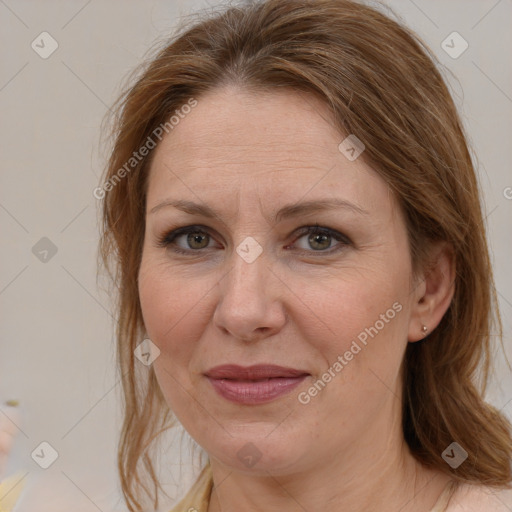 Joyful white adult female with medium  brown hair and grey eyes