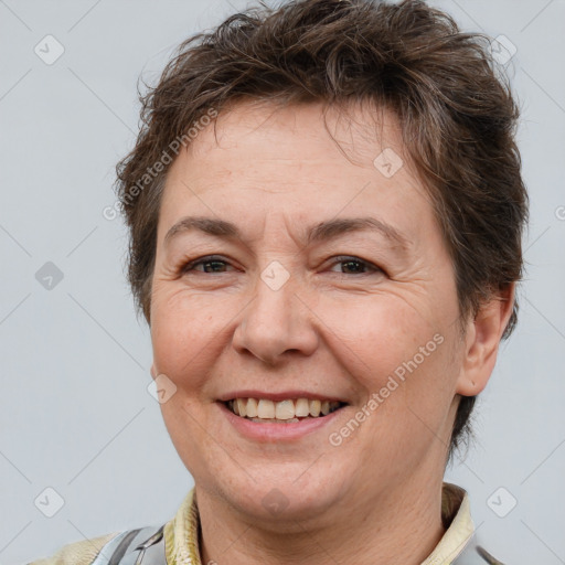 Joyful white adult female with short  brown hair and brown eyes