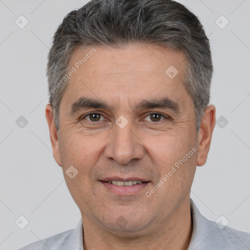 Joyful white adult male with short  brown hair and brown eyes