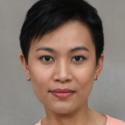 Joyful asian young-adult female with short  black hair and brown eyes