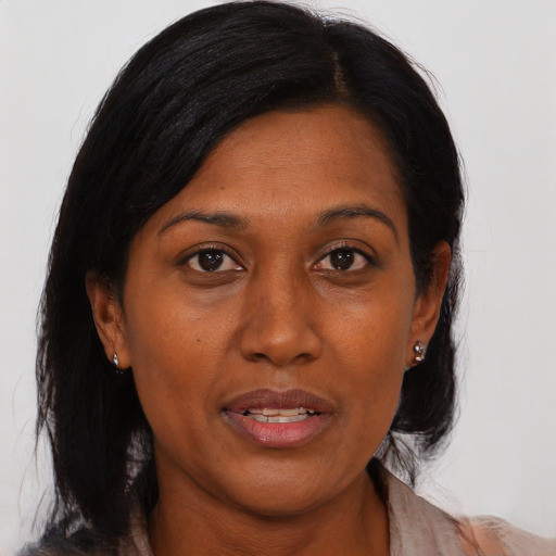 Joyful asian adult female with medium  black hair and brown eyes