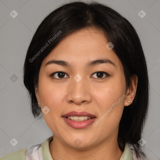 Joyful asian young-adult female with medium  black hair and brown eyes