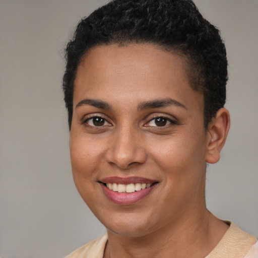 Joyful white young-adult female with short  brown hair and brown eyes