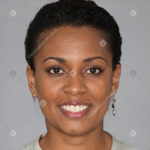 Joyful black young-adult female with short  black hair and brown eyes