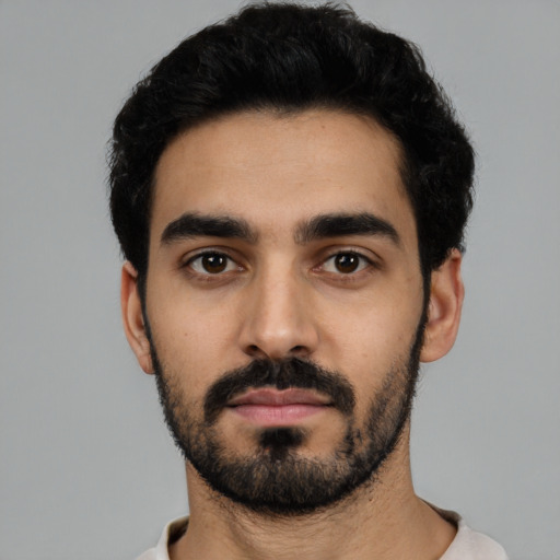 Neutral latino young-adult male with short  black hair and brown eyes