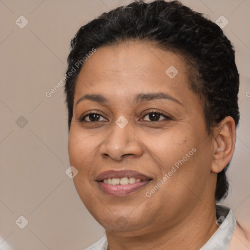 Joyful latino adult female with short  brown hair and brown eyes