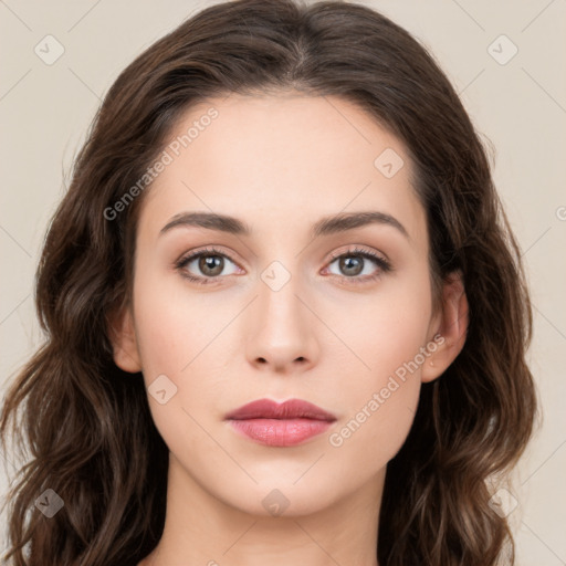 Neutral white young-adult female with long  brown hair and brown eyes