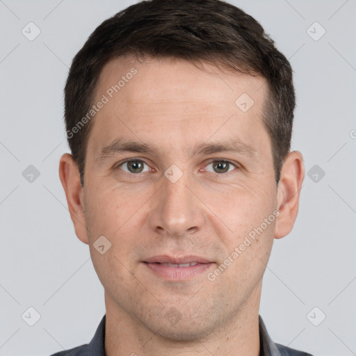 Joyful white adult male with short  brown hair and grey eyes