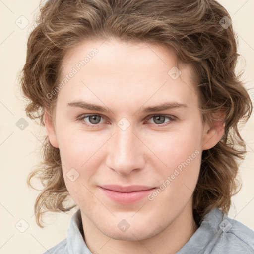 Joyful white young-adult female with medium  brown hair and blue eyes