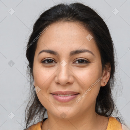 Joyful latino young-adult female with medium  brown hair and brown eyes