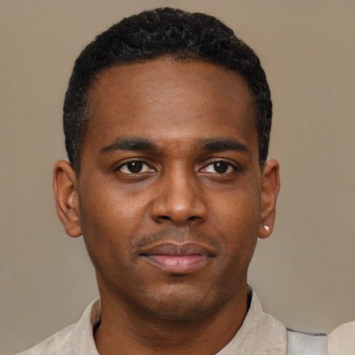 Neutral black young-adult male with short  black hair and brown eyes