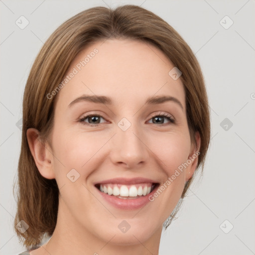 Joyful white young-adult female with medium  brown hair and green eyes