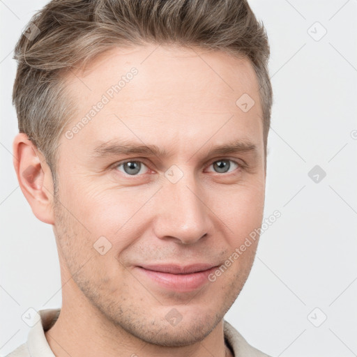 Joyful white young-adult male with short  brown hair and grey eyes