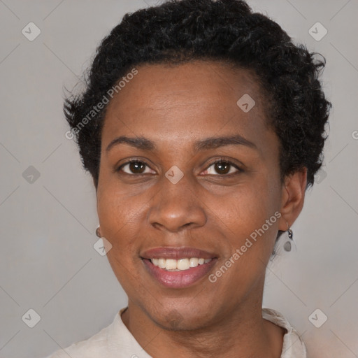 Joyful black young-adult female with short  black hair and brown eyes