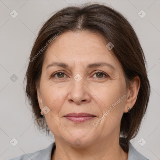 Joyful white adult female with medium  brown hair and brown eyes