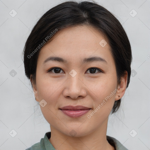 Joyful asian young-adult female with medium  brown hair and brown eyes