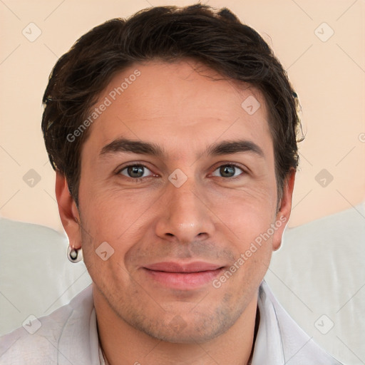 Joyful white adult male with short  brown hair and brown eyes