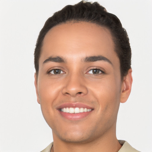 Joyful white young-adult male with short  black hair and brown eyes