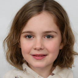 Joyful white child female with medium  brown hair and brown eyes