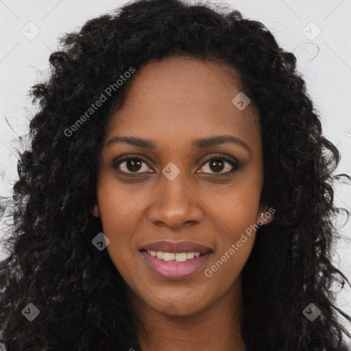 Joyful black young-adult female with long  black hair and brown eyes