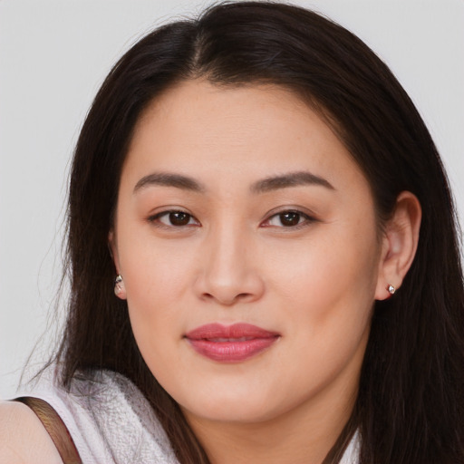 Joyful asian young-adult female with long  brown hair and brown eyes