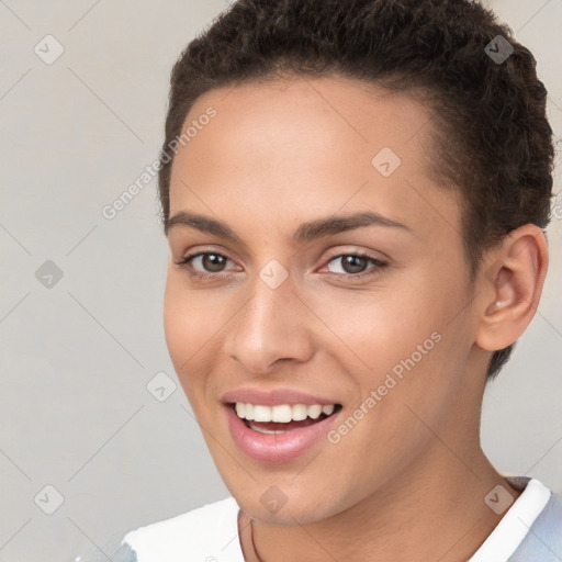 Joyful white young-adult female with short  brown hair and brown eyes