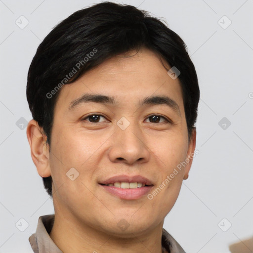 Joyful asian young-adult male with short  brown hair and brown eyes