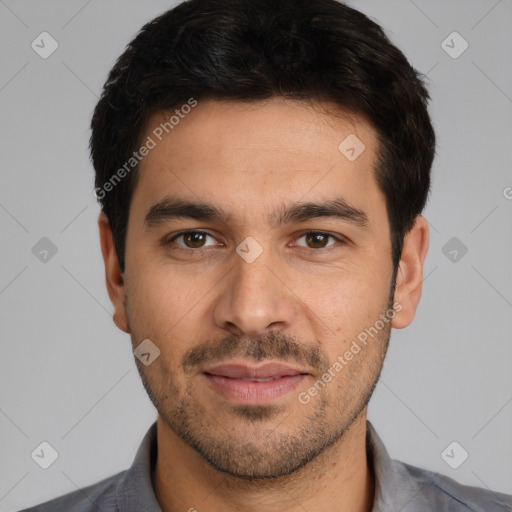 Joyful white young-adult male with short  black hair and brown eyes