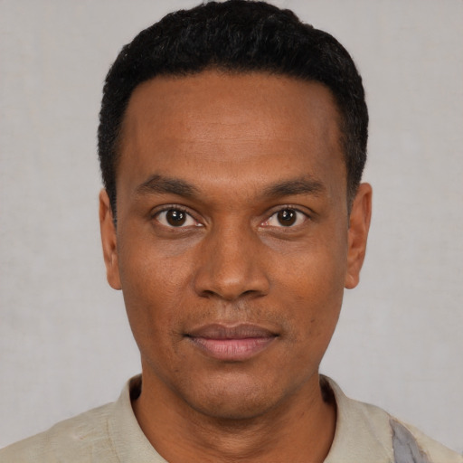 Neutral black young-adult male with short  black hair and brown eyes