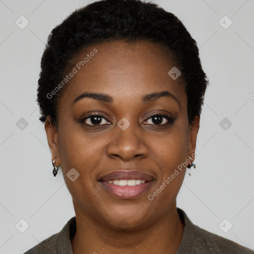 Joyful black young-adult female with short  black hair and brown eyes