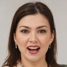 Joyful white young-adult female with long  brown hair and brown eyes