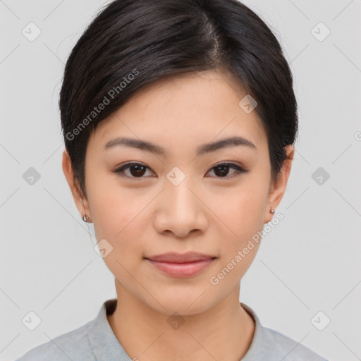 Joyful asian young-adult female with short  black hair and brown eyes