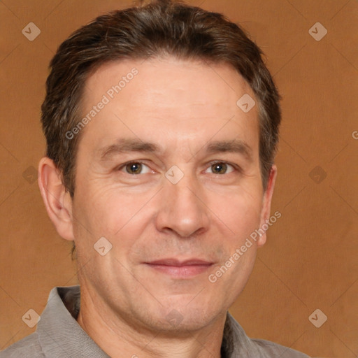 Joyful white adult male with short  brown hair and brown eyes