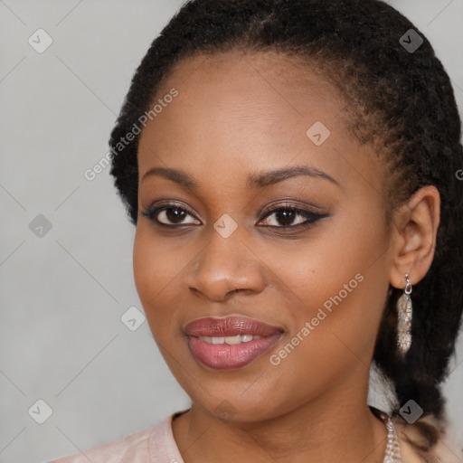 Joyful black young-adult female with long  brown hair and brown eyes