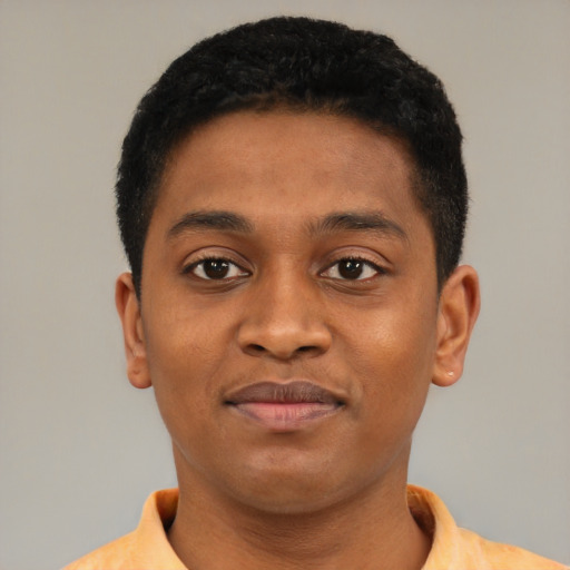 Joyful latino young-adult male with short  brown hair and brown eyes