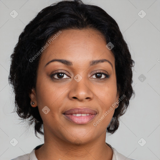 Joyful black adult female with medium  brown hair and brown eyes