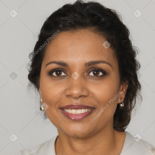 Joyful black adult female with short  brown hair and brown eyes