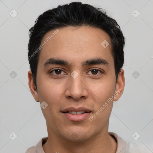 Joyful white young-adult male with short  black hair and brown eyes