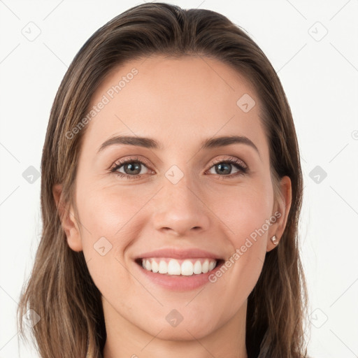 Joyful white young-adult female with long  brown hair and grey eyes