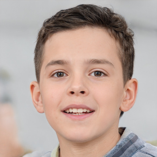 Joyful white child male with short  brown hair and brown eyes