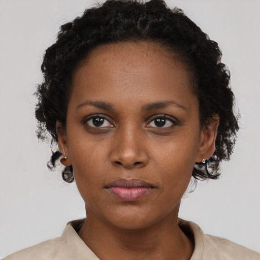 Neutral black young-adult female with short  black hair and brown eyes