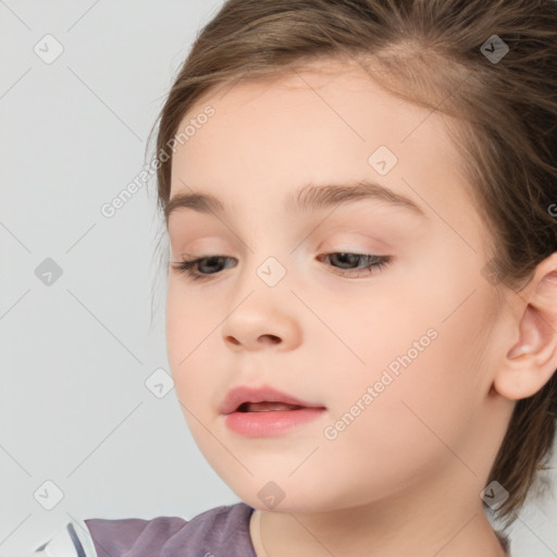 Joyful white child female with medium  brown hair and brown eyes