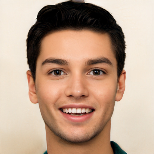 Joyful white young-adult male with short  black hair and brown eyes